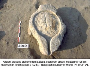 Caption: This is an ancient pressing platform from Lattara, seen from above. Note the spout for drawing off a liquid. It was raised off the courtyard floor by four stones. Masses of grape remains were found nearby. Credit: Photograph courtesy of Michael Py, copyright l'Unité de Fouilles et de Recherches Archéologiques de Lattes.
