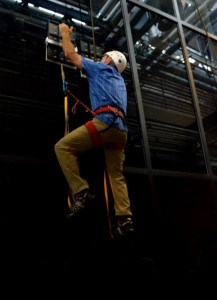 During testing, an operator climbed 25 feet vertically on a glass surface using no climbing equipment other than a pair of hand-held, gecko-inspired paddles. The climber wore, but did not require, the use of a safety belay. Image: DARPA