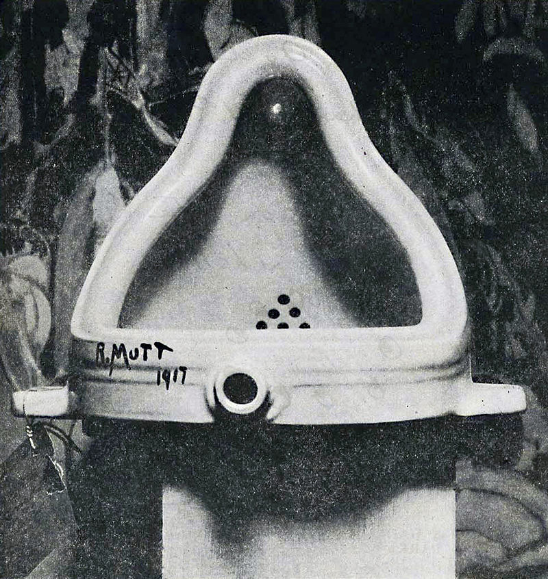 The original Fountain by Marcel Duchamp photographed by Alfred Stieglitz at the 291 (Art Gallery) after the 1917 Society of Independent Artists exhibit. Stieglitz used a backdrop of The Warriors by Marsden Hartley to photograph the urinal. The entry tag is clearly visible. [downloaded from https://en.wikipedia.org/wiki/Fountain_%28Duchamp%29]