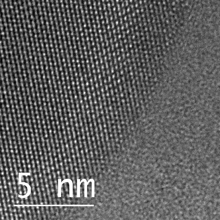 This is an atomic view of liquid and solid gallium coexisting in a single nanoparticle taken by a transmission electron microscope. The circular shape on the left-hand side shows gallium atoms in an organized, crystalline, solid structure, while the atoms on the right are in liquid form, showing no organized structure at all. Courtesy: Duke University